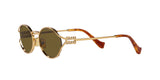 Miu Miu MU 52YS 7OE01T sunglasses, brass gold frame with dark brown lenses, angled side view