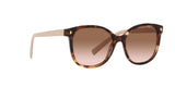 Prada PR 22ZS 07R0A6 sunglasses, caramel tortoise frame with brown gradient lenses, angled front view