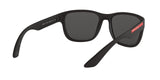 Prada Linea Rossa PS 01US DG05S0 sunglasses, black rubber frame with grey lenses, rear angled view